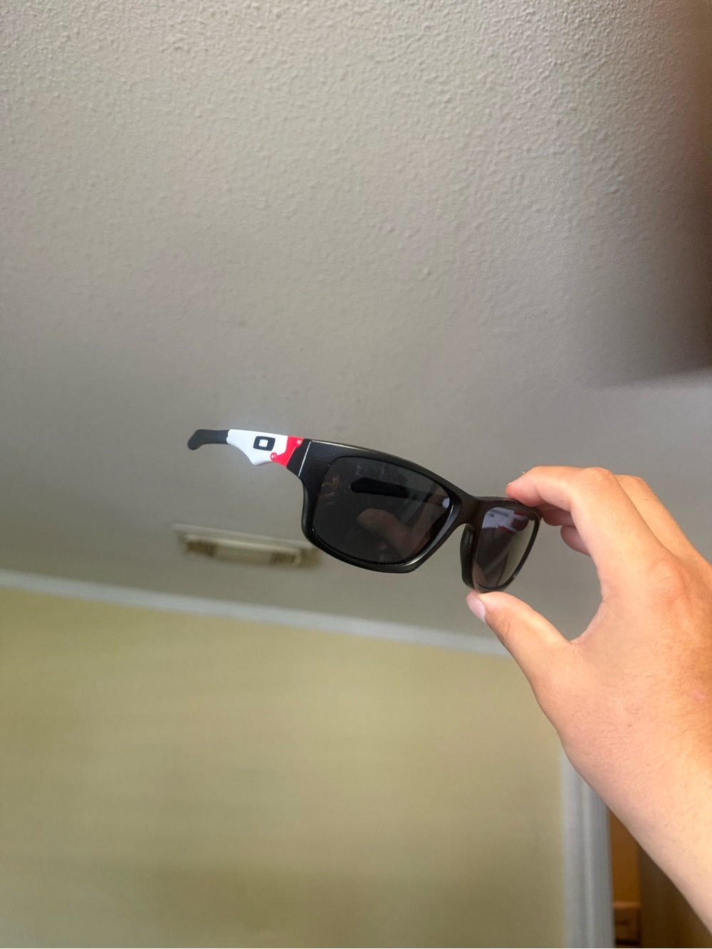 Oakley Black Sunglasses with White and Red Temple Accents